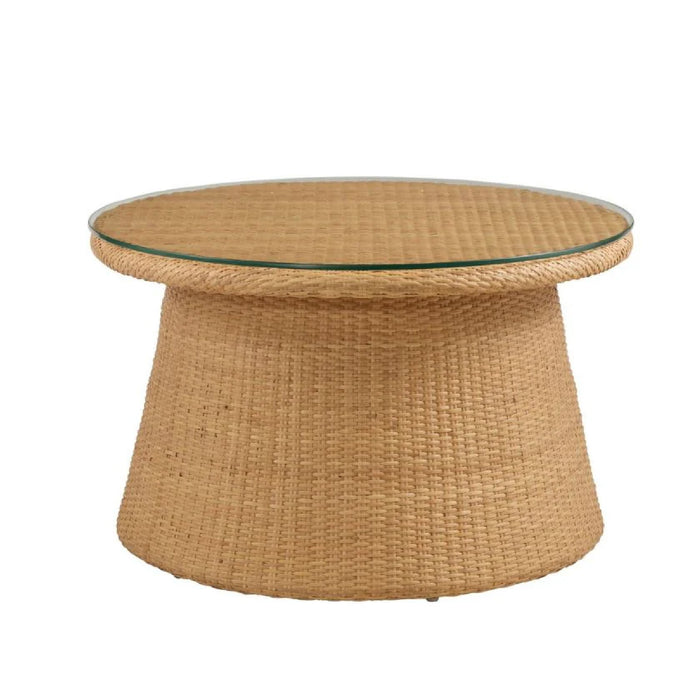 Round woven coffee table with a glass top on a white background