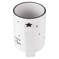 This set of four Holiday Merry & Bright Organic Mugs from Santa Barbara Design Studio features 16oz ceramic mugs adorned with black star designs and festive "merry & bright" text, making them an ideal holiday gift.