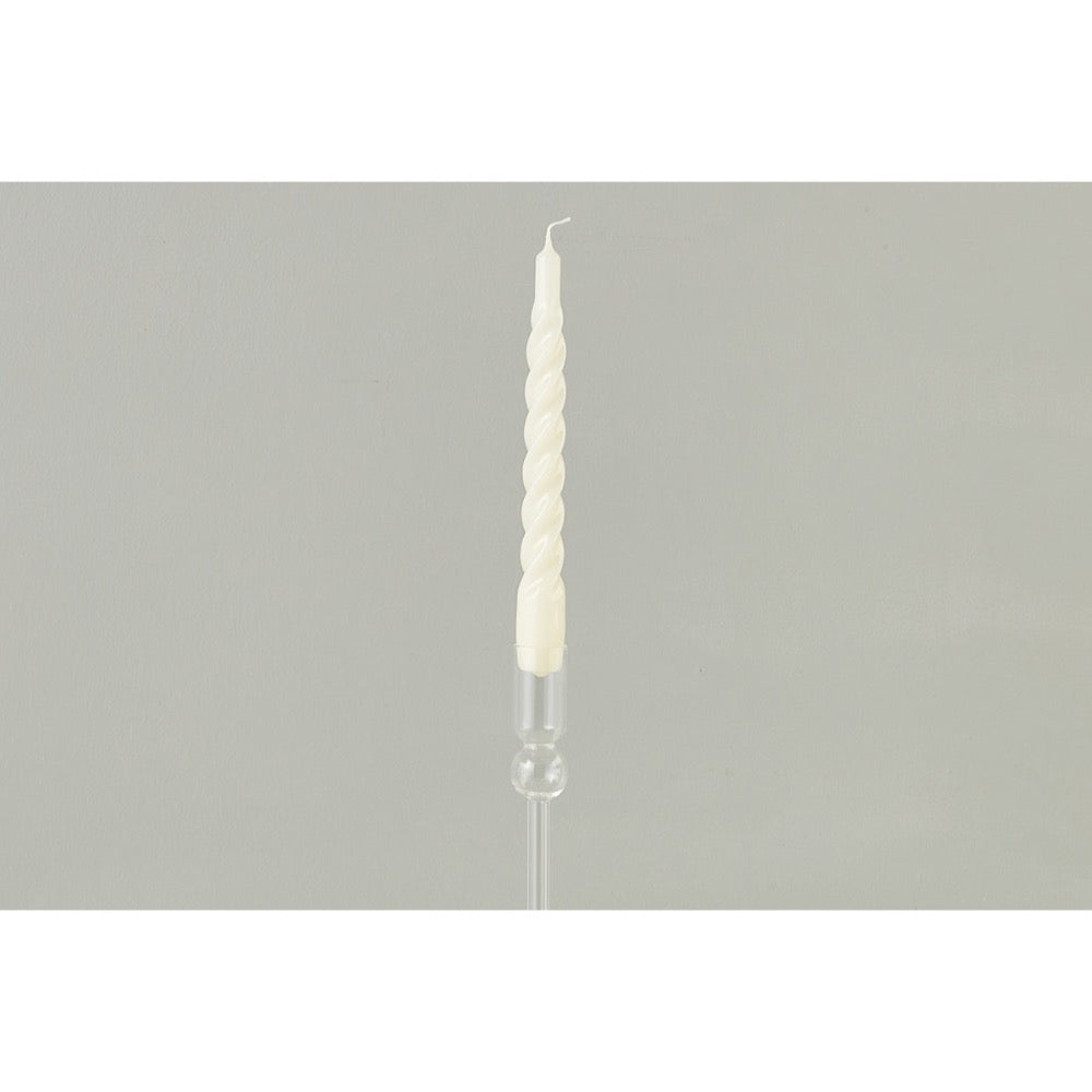 Taper candle with spiral design on a gray background