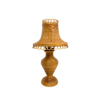 Wicker lamp with a decorative shade on a white background