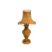 Wicker lamp with a decorative shade on a white background