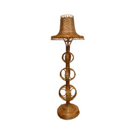 Wicker lamp with a decorative base on a white background