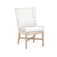 The Lattis Host Chair by Essentials for Living features a white woven rope seat, lattice backrest, and light wood legs.
