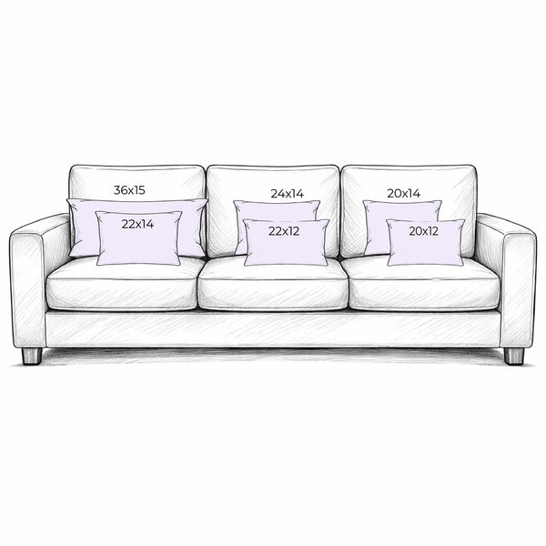 White sofa with decorative pillows and their dimensions on a white background