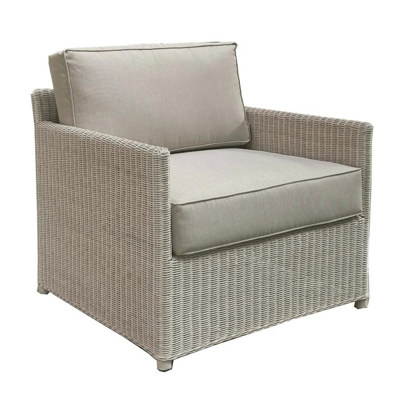 whitewashed rattan lounge chair with cushions
