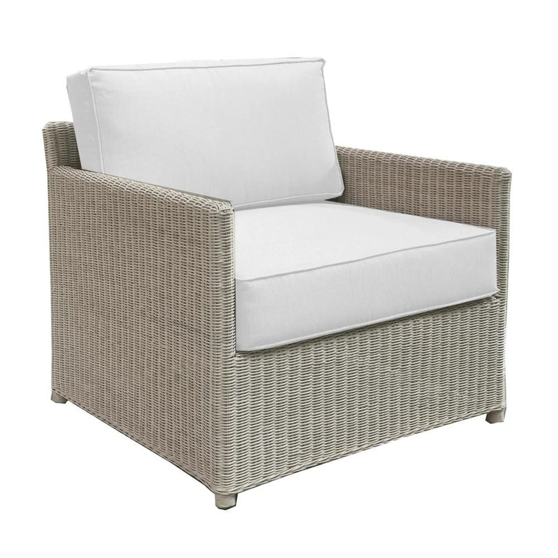 whitewashed rattan lounge chair with cushions