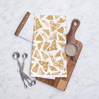 Cooking utensils with a Muse Textiles Flour Sack Moths Kitchen Towel arranged on a marble countertop.