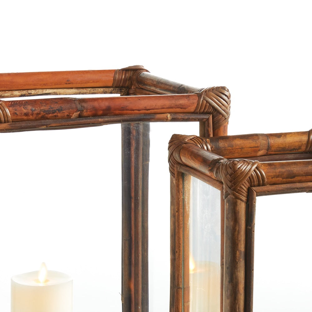 Close-up of a wooden lantern with a candle inside on a white background
