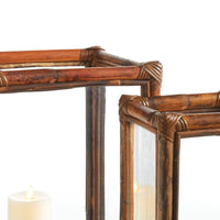 Close-up of a wooden lantern with a candle inside on a white background