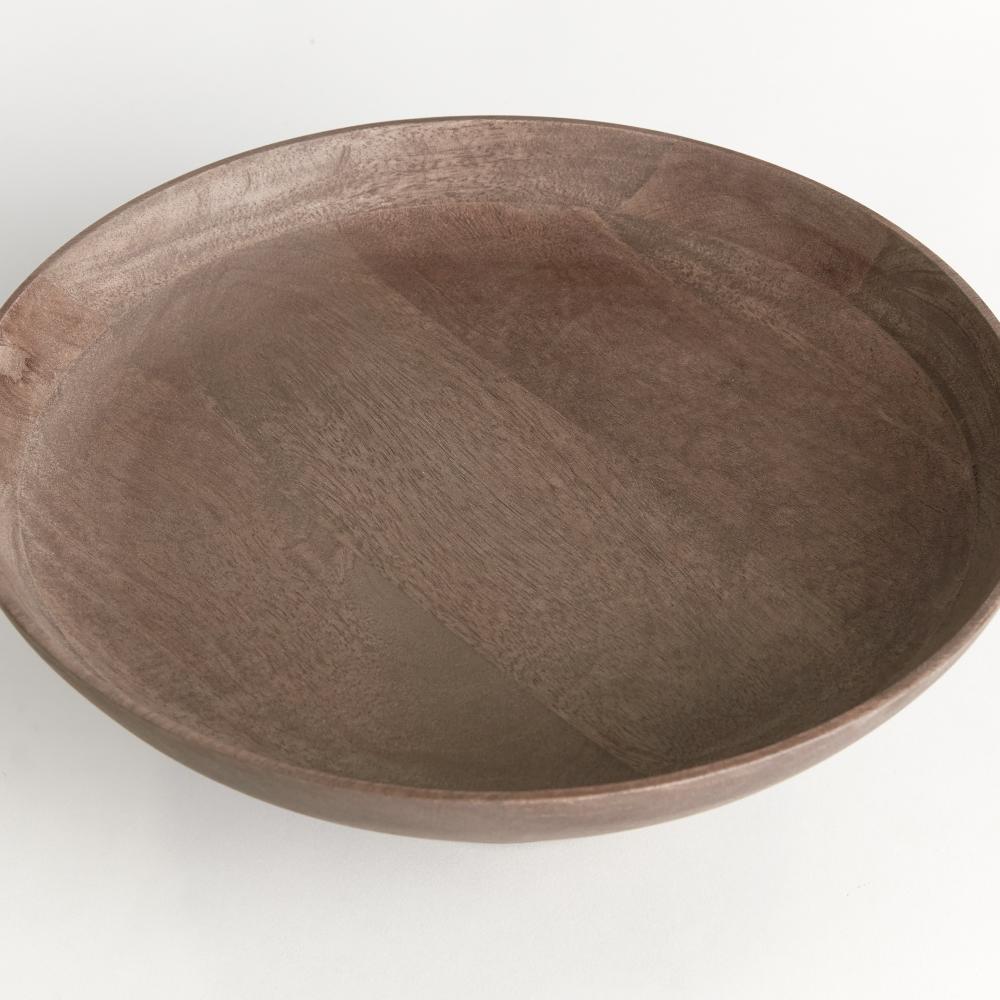 A round wooden bowl with a smooth, matte finish and visible wood grain, photographed from a high angle on a plain white background.