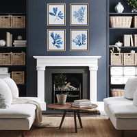 Living room with white fireplace, blue wall art, and white furniture.