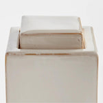 lidded cream color rectangular jar