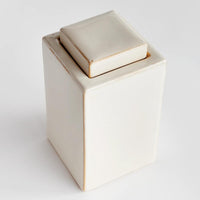 lidded cream color rectangular jar