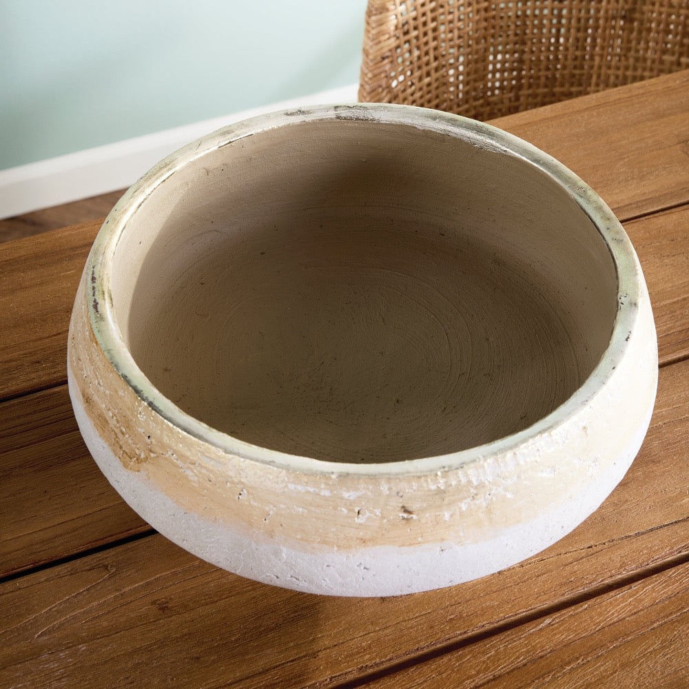 Ceramic bowl on a wooden surface with a blurred background
