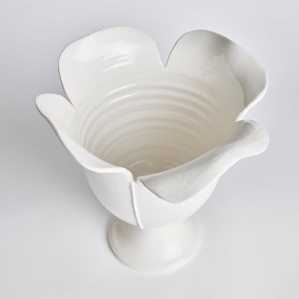 White ceramic vase with a unique petal design on a light gray background