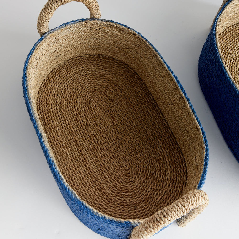 Woven basket with blue exterior and natural interior and natural handle 