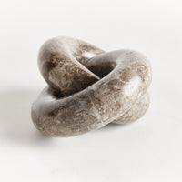 Decorative stone knot on a white background