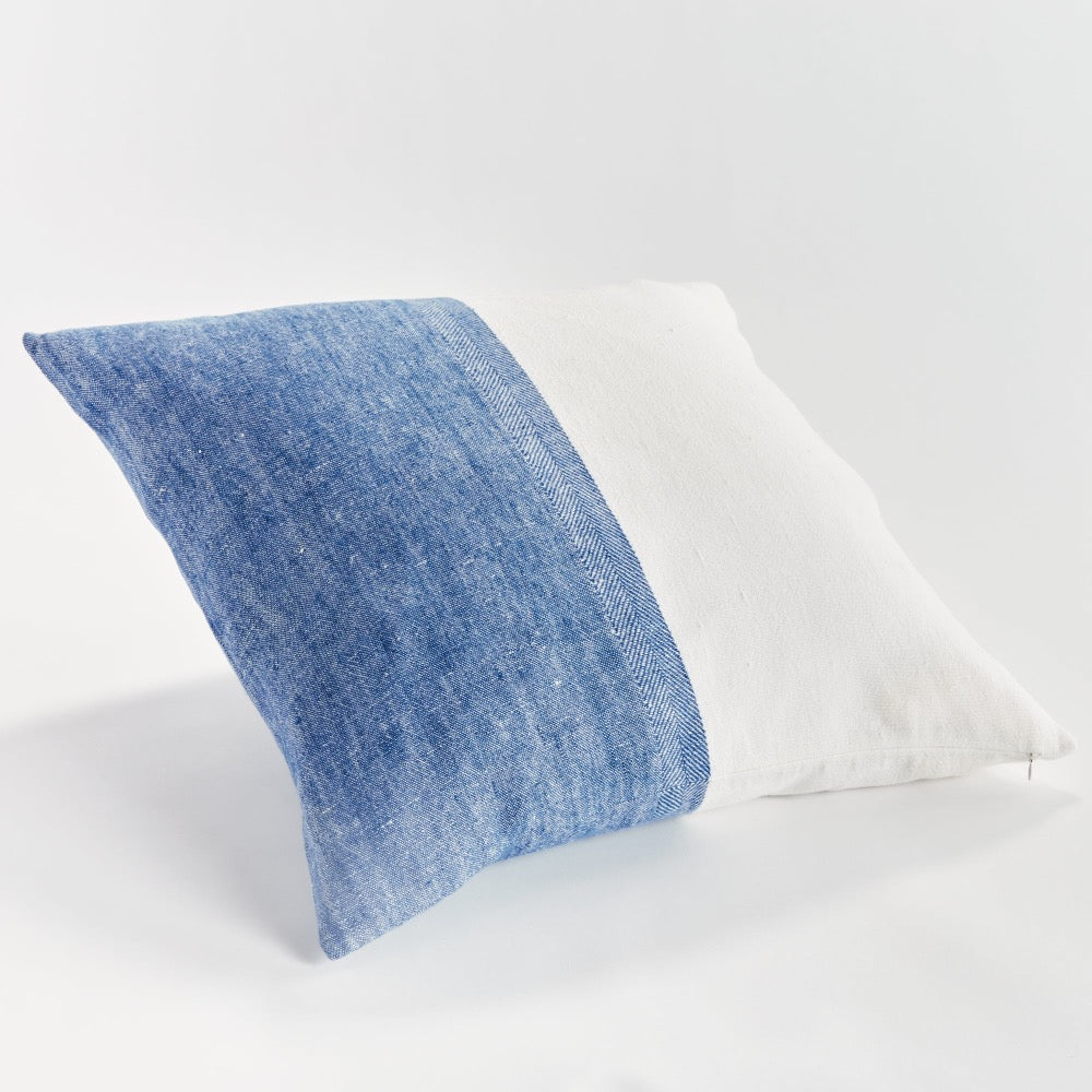 Blueand white  textured pillow on a white background