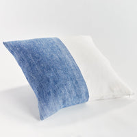 Blueand white  textured pillow on a white background