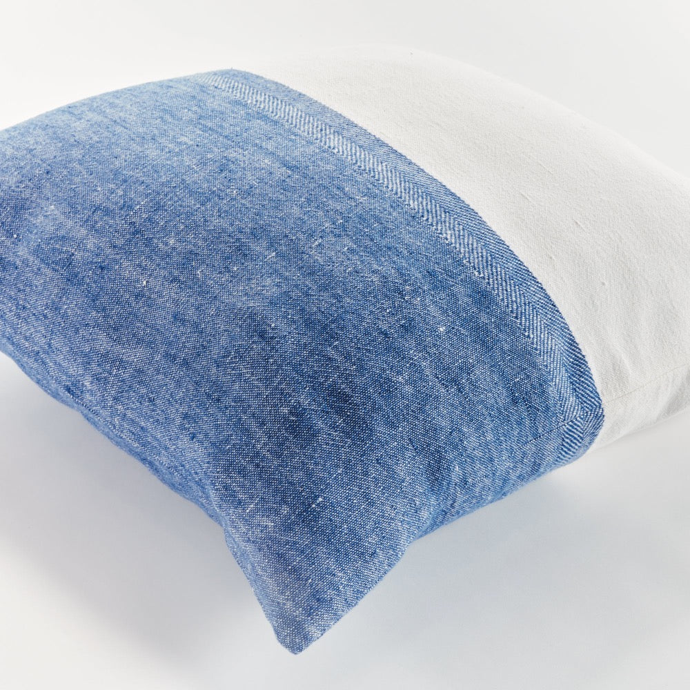 Blue and white textured pillow on a white background