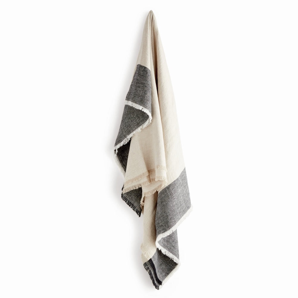 Black and white striped throw on a white background