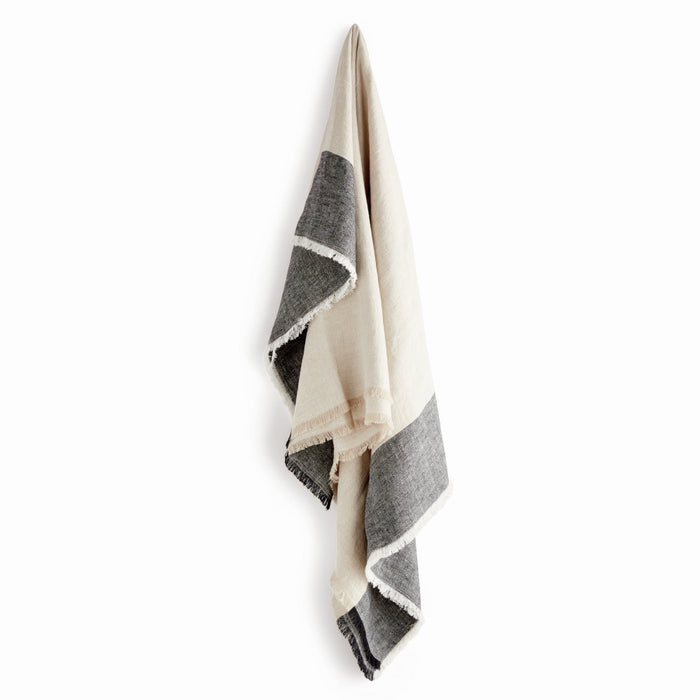 Black and white striped throw on a white background