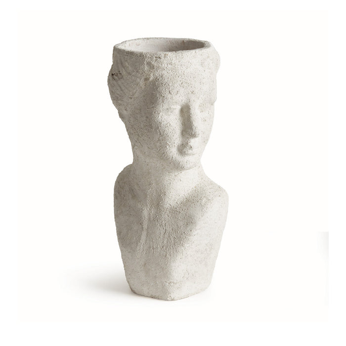 Cement sculpture of a face on a white background