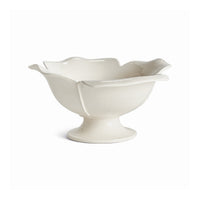 White ceramic bowl with a petal-like design on a white background
