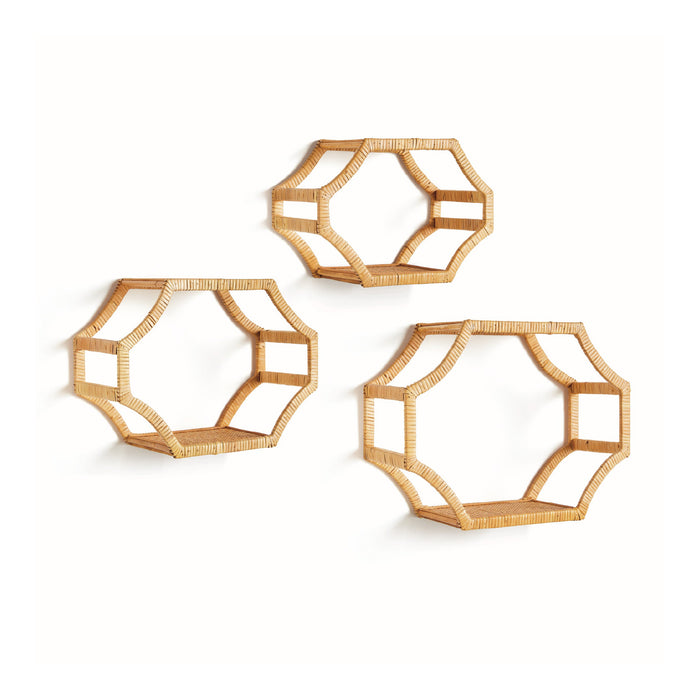 Three geometric wall shelves made of rattan on a white background