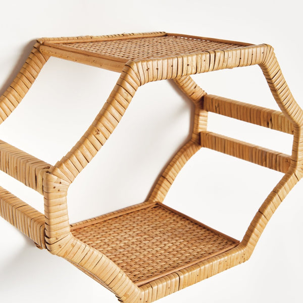 Woven rattan shelf on a white background