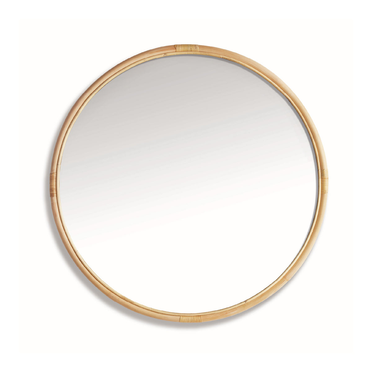 Round mirror with a rattan frame on a white background