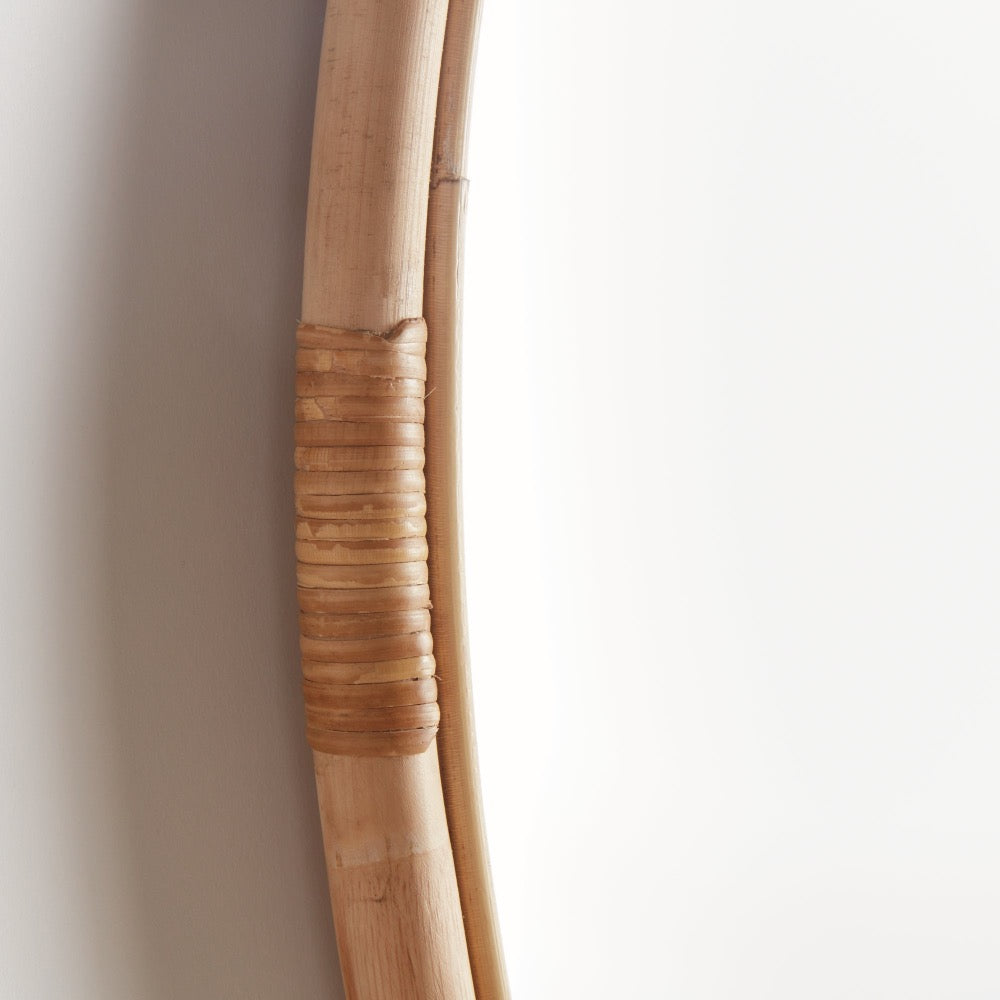 Close-up of a rattan frame against a plain background