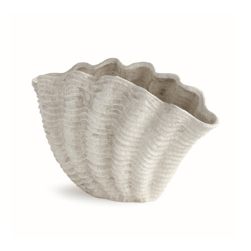 Shell-shaped decorative vase on a white background