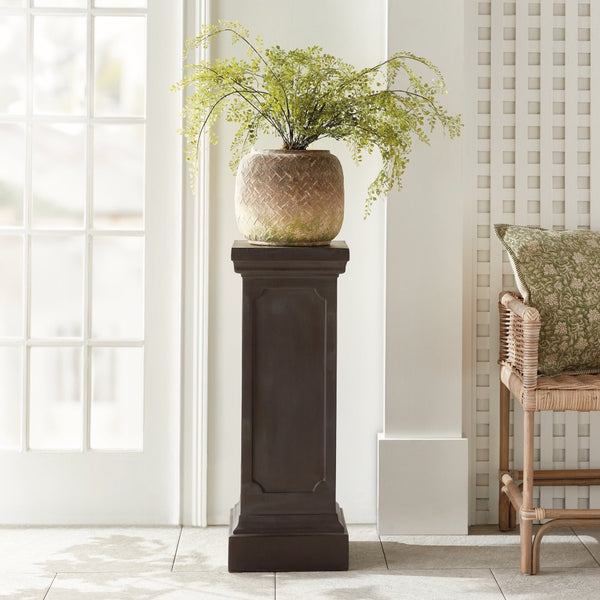 A leafy plant in a lightweight concrete planter sits on the Napa Home & Garden Fibreclay Chambers Pedestal.