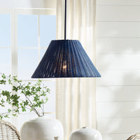 Blue woven pendant light fixture in a room with a window and white walls.