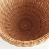 Close-up of a woven brown basket on a white background