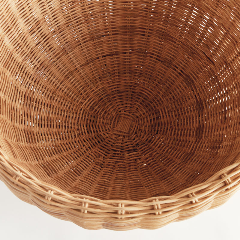 Close-up of a woven brown basket on a white background