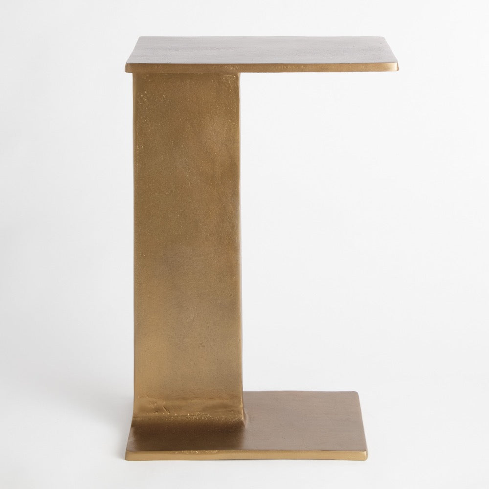 gold side table on a white background