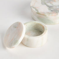 Marble-patterned ceramic containers on a white background