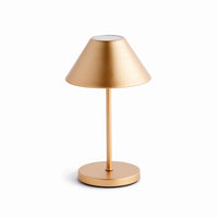Gold table lamp on a white background