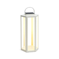 White lantern with a light inside on a white background