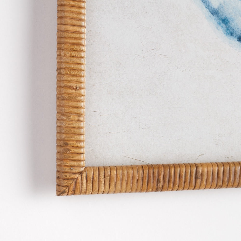 Close-up of a rattan picture frame on a white background