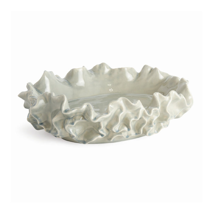 Decorative ceramic bowl with shell-like design on a white background