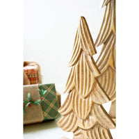 Wooden Christmas tree decoration with presents in the background