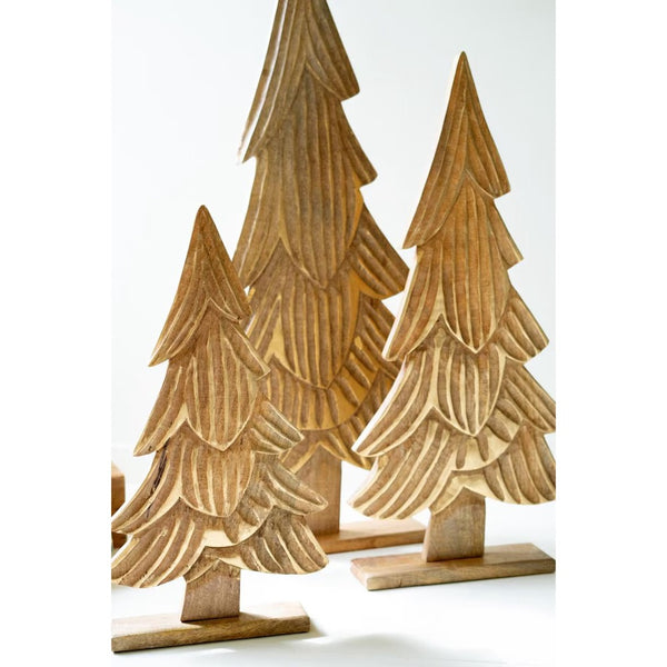 Set of three wooden Christmas trees on a white background