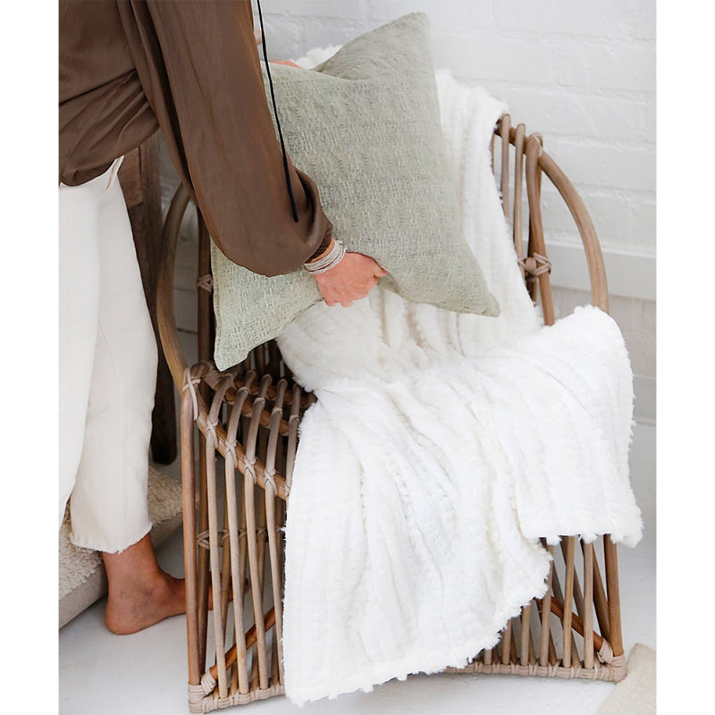 white throw blanket on chair 