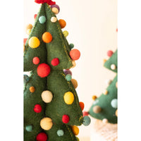 Close up of a green felt christmas tree with colored pom pom balls