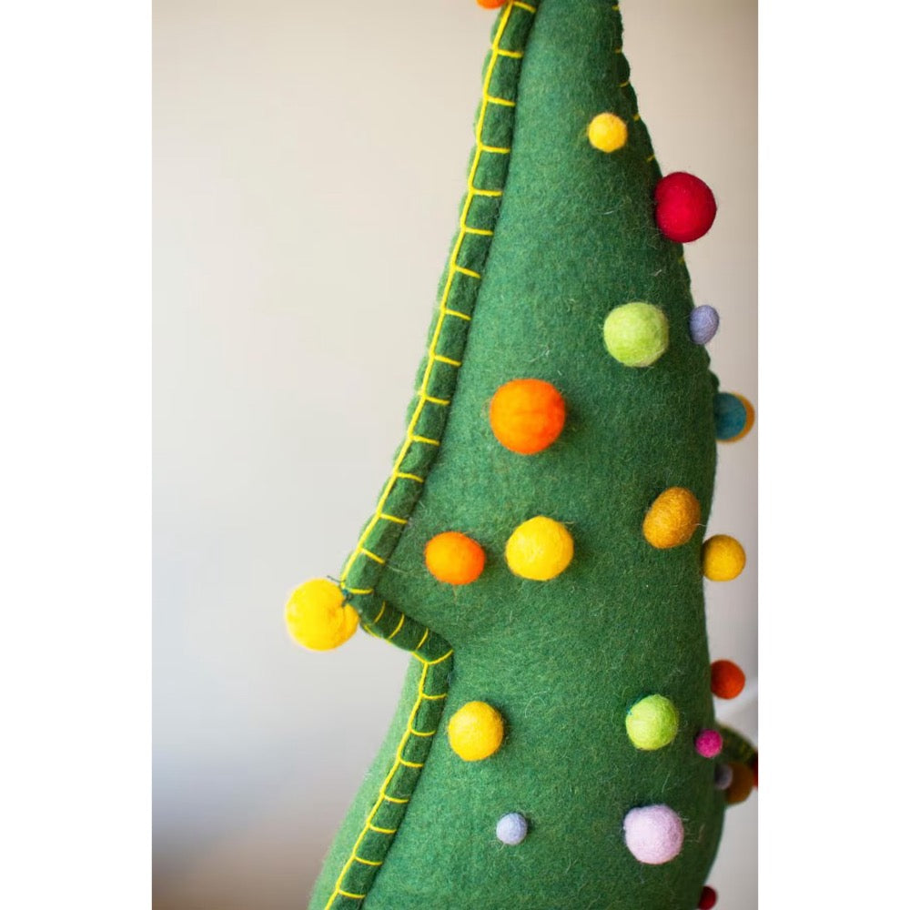 Side view of top part of green felt christmas tree with colored pom pom balls.