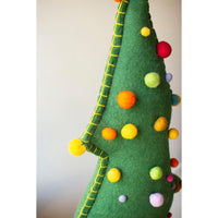 Side view of top part of green felt christmas tree with colored pom pom balls.