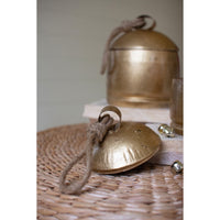 two gold christmas bell canisters holiday decor